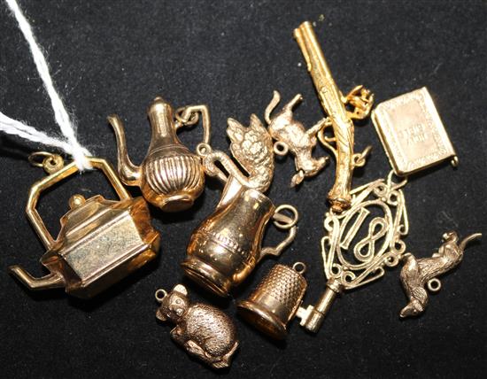 Eleven assorted 9ct gold charms.